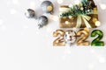 Flat lay greeting card happy new year numbers 2022 and craft gifts on light background with bokeh Royalty Free Stock Photo
