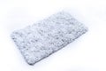 Flat lay, grey color of microfiber bath mat isolated on white background Royalty Free Stock Photo