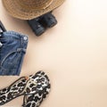 Flat lay grey suitcase with binoculars, hat, jeans and sandles on pastel background. travel concept - Image