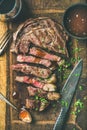 Grilled medium rare ribeye beef steak with red wine, flat-lay Royalty Free Stock Photo
