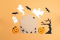 Flat lay Halloween background with cartoon house, spiders,pumpkins and ghosts. Royalty Free Stock Photo