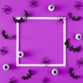 Flat lay Halloween background made with bats, spiders and eyeballs