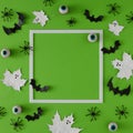 Flat lay Halloween background made with leaves painted in white like ghosts, bats and eyeballs.