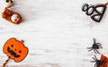 Flat lay Happy Halloween festival background concept. Mix varietyof accessory decoration objects on the grunge rustic white wood. Royalty Free Stock Photo