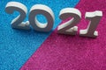 2025 Happy New Year with space copy on blue and pink glitter background