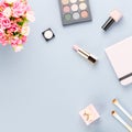 Flat lay home office desk. Feminine workspace with planner, flowers, cosmetics. Beauty blogger concept. Royalty Free Stock Photo