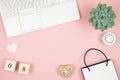 Flat lay home office desk. Women workspace with laptop and data on pink background. 8 March World Womens day concept