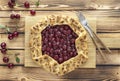 Flat lay of homemade cherry open pie galette