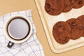 Flat lay of homemade sweets, Chocolate cookies are stack on plate and coffee over wood background Royalty Free Stock Photo