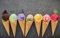 Flat lay ice cream cones collection on dark stone background . Blank crispy ice cream cone with copy space . Royalty Free Stock Photo