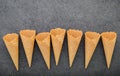 Flat lay ice cream cones collection on dark stone background . Blank crispy ice cream cone with copy space. Royalty Free Stock Photo