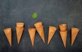 Flat lay ice cream cones collection on dark stone background . Blank crispy ice cream cone with copy space Ã Â¹Æ Royalty Free Stock Photo