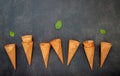 Flat lay ice cream cones collection on dark stone background . Blank crispy ice cream cone with copy space Ã Â¹Æ Royalty Free Stock Photo