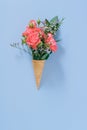 Flat lay Ice Cream Cones with colorful bouquet on blue background Royalty Free Stock Photo