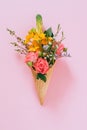 Flat lay Ice Cream Cones with colorful bouquet on pink background Royalty Free Stock Photo