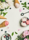 Flat-lay of ice cream scoops and peonies, vertical composition Royalty Free Stock Photo