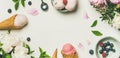 Flat-lay of ice cream scoops and peonies, wide composition Royalty Free Stock Photo