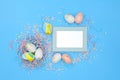Flat lay image composition of Easter eggs, colorful foam balls. Modern minimal design template of postcard. Top view