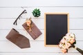 Flat lay image of gift box, necktie, glasses, rose flower and blank space chalkboard.  Top view with copy space for your Royalty Free Stock Photo