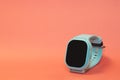 flat lay image of kids smart watch on pastel orange background Royalty Free Stock Photo