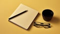 A legal pad, black pencil, glasses and a cup coffee on yellow background. generative ai.