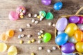 Plastic easter eggs being filled with chocolates before easter egg hunt. Royalty Free Stock Photo