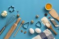 Flat lay ingredients for baking and kitchen utensils on a blue background. Top view, place for your text Royalty Free Stock Photo