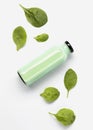 Flat lay juice bottle with spinach leaves. High quality and resolution beautiful photo concept