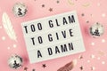 Lightbox with phrase Too glam to give a damn Royalty Free Stock Photo