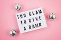 Lightbox with phrase Too glam to give a damn Royalty Free Stock Photo