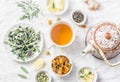 Flat lay liver detox antioxidant tea, teapot and the ingredients for it on a light background, top view. Herbal homeopathic recep