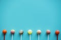 Flat lay of lollipops isolated on light blue Royalty Free Stock Photo