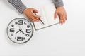 Flat lay with male hands with clock, notepad and pencil. businnes concept. white background