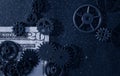 Flat-lay mechanical gears on a twenty dollar bill