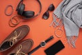 Flat lay of men's accessories with shoes, watch, phone, earphone Royalty Free Stock Photo