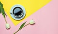 Flat lay of minimalistic picture of coffee on pink and yellow background. Minimalism coffee concept