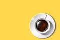 Flat lay of minimalistic picture of coffee on yellow background. Minimalism coffee concept.