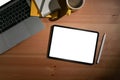 Flat lay digital tablet, stylus pen and laptop computer on wooden background. Royalty Free Stock Photo