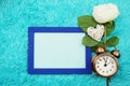 Mock-up space Photo Frame with alarm clock and peony flower Royalty Free Stock Photo