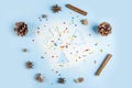 Flat lay mockup of Christmas baking. Homemade cooking. Cinnamon, anise and form for cookies on flour on blue background. Copy