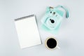 Flat lay with modern mini camera, empty notebook and cup of coffee. Flat lay style composition Royalty Free Stock Photo