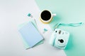 Flat lay with modern mini camera, two notebook and cup of coffee. Fashion blogger, minimal concept Royalty Free Stock Photo