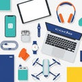 Flat lay of modern tech gadgets including laptop, tablet, smartphone, and accessories Royalty Free Stock Photo