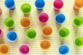 Flat lay of multi-colored plastic cups on a yellow background. Concept items for fast food. Top view Royalty Free Stock Photo