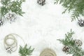 Flat lay New Year Christmas frame made of fir branches, festive decorations and pine cones on white background Royalty Free Stock Photo