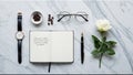Flat Lay of a Notebook, Fountain Pen, Glasses, Coffee Beans, and a White Rose on Marble Royalty Free Stock Photo