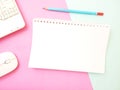 Flat Lay, Office Conceptual Flat Lay Notebook and wireless Mouse and pencil at texturized Blue Pink Background