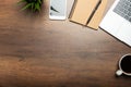 Flat lay of Office desk wooden table with laptop, and smartphone and equipment other office supplies Royalty Free Stock Photo