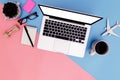 Flat lay office workspace with blank laptop, clipboard, top view laptop background and copy space on pink and blue background, Royalty Free Stock Photo