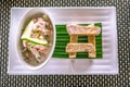 Flat lay of Oka - known as kokoda, poke, ceviche, or poisson cru - is Polynesian raw fish salad from Samoa, with taro chips